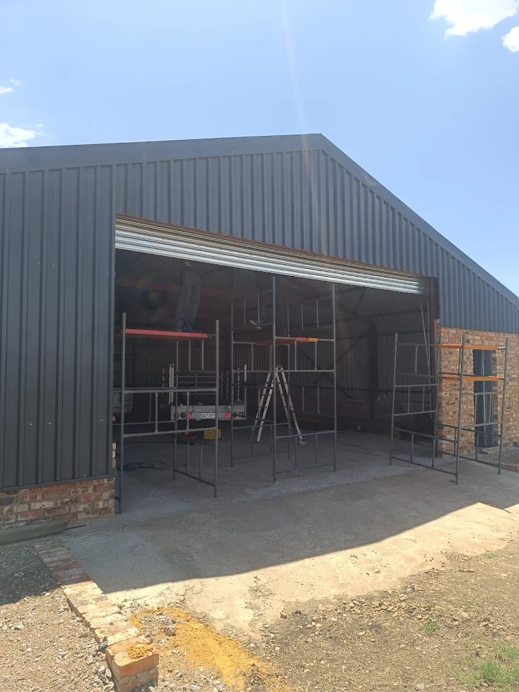 Finished silver roller shutter door installed on industrial shed