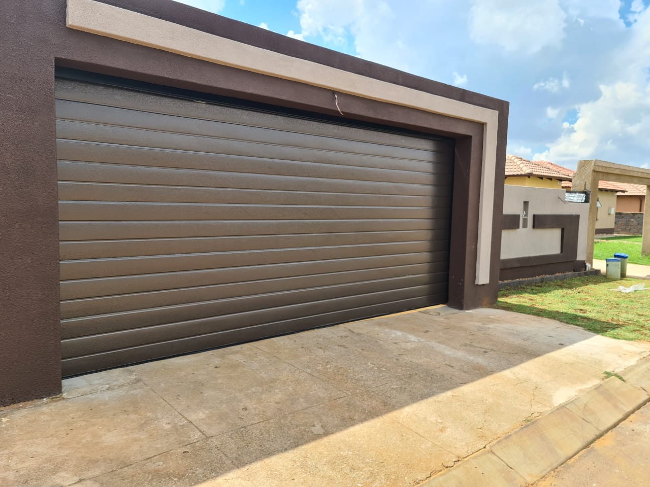 Classic timber garage door with decorative hardware